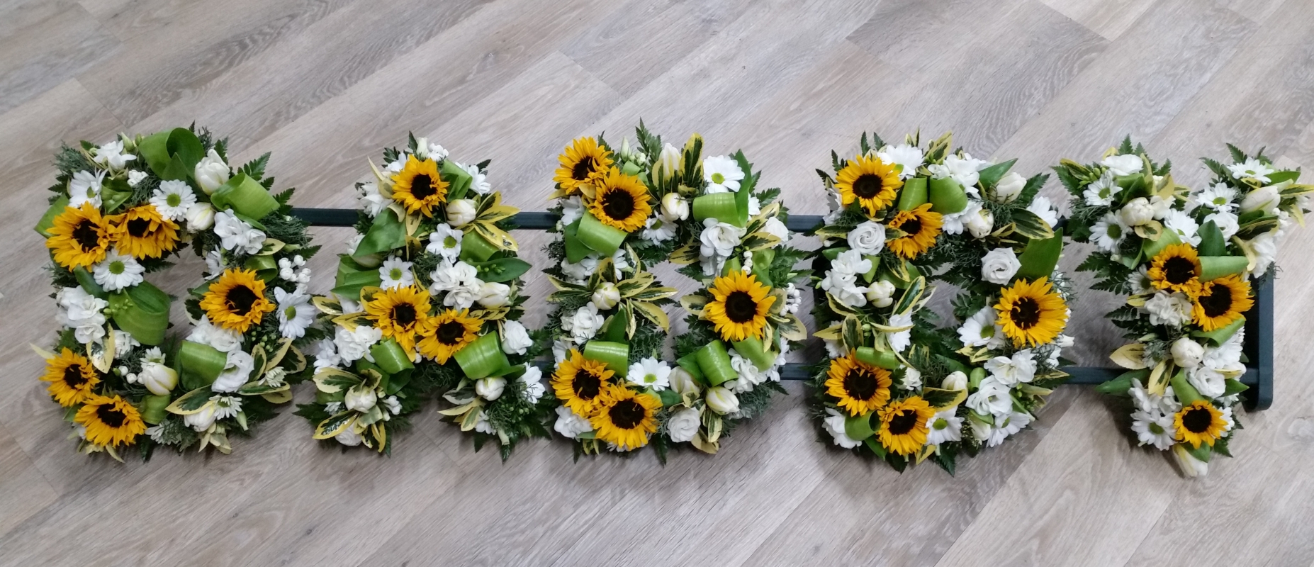 Mixed and loose flower and foliage grandparent letter funeral tribute
