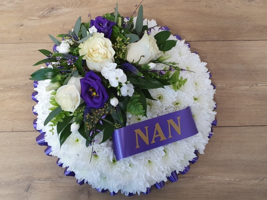 Based white chrysanthemum and purple flower funeral tribute posy with coloured ribbon and optional name