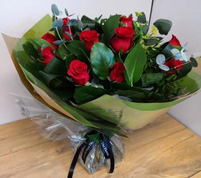 A Dozen Best grade Red Roses with luxurious foliage