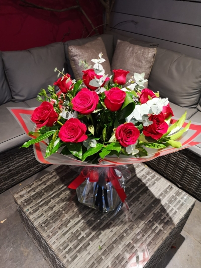 A Dozen Best grade Red Roses with luxurious foliage