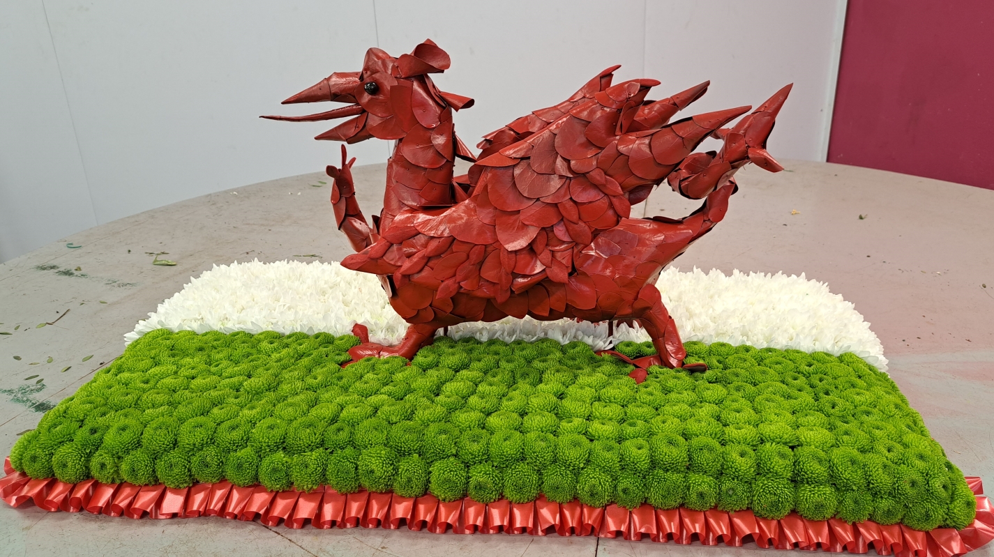 3d white, green and red welsh dragon flag flower funeral tribute