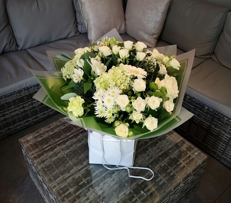 white and green neutral flower handtied bouquet in a gift bag