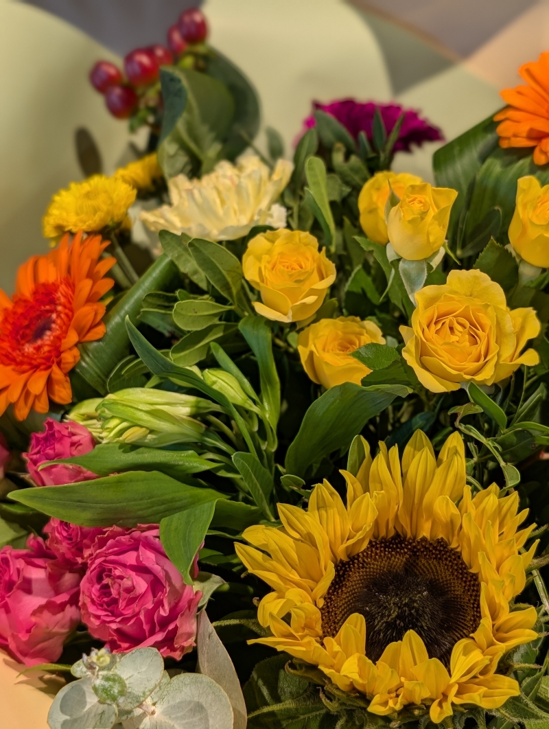 Rich and vibrant autumnal flowers in a gift bag