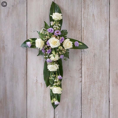 lilac and white flower and foliage cross funeral tribute