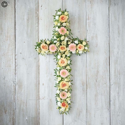 peach and pastel flower and foliage cross funeral tribute