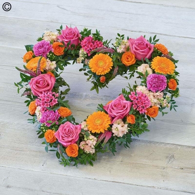 bright flower and foliage open heart funeral tribute 