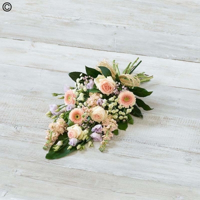pink and pastel flower and foliage funeral sheaf