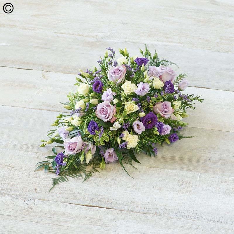 mixed flower and foliage single ended funeral coffin spray