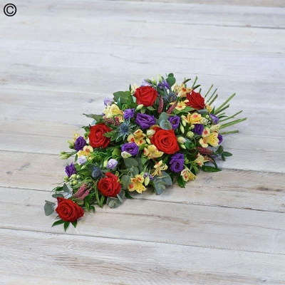 mixed flower and foliage single ended funeral coffin spray