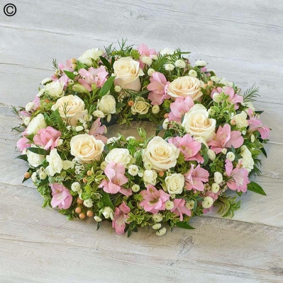 pastel flower and foliage funeral tribute wreath