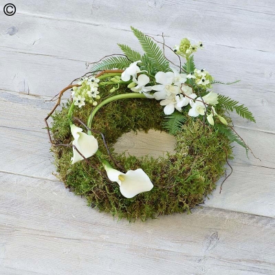 mossed foliage funeral tribute wreath with white cala lily flowers