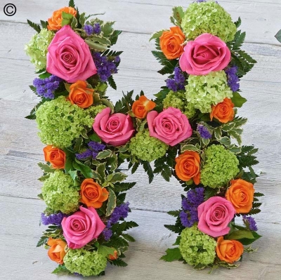 mixed flower and foliage funeral tribute letters