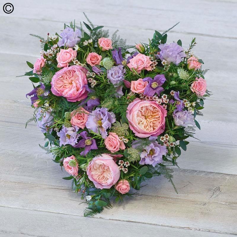 cottage style flower and foliage heart shaped funeral tribute