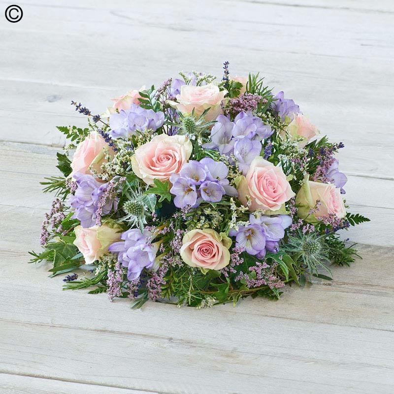rose and freesia flower and foliage funeral tribute posy