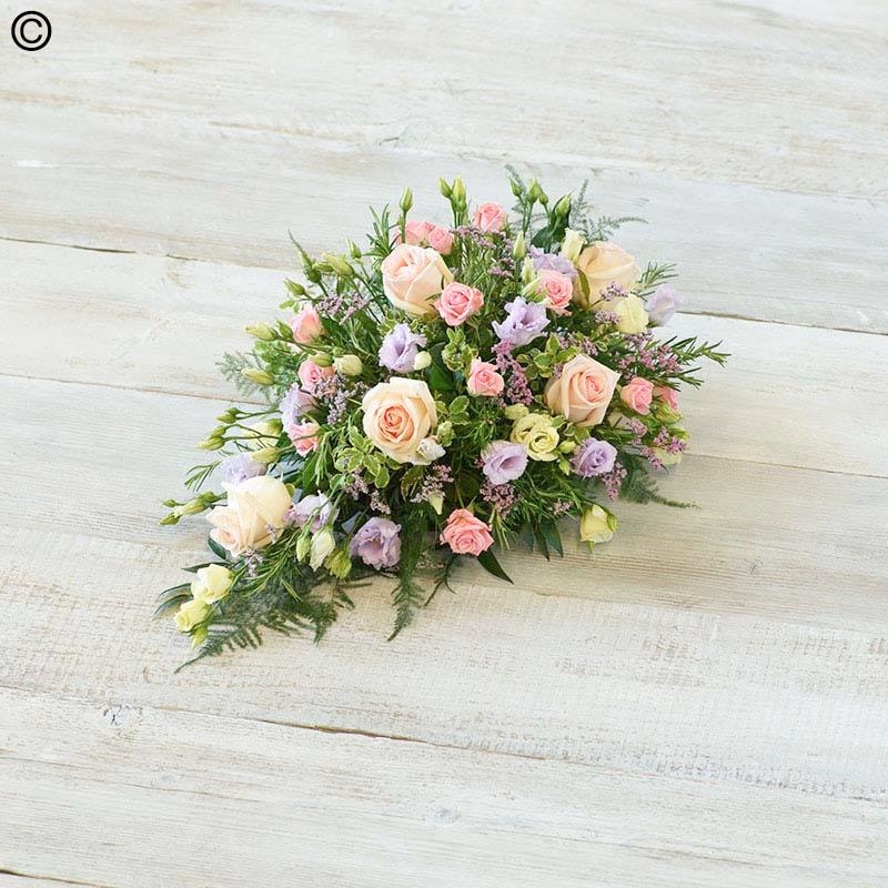 mixed flower and foliage single ended funeral coffin spray