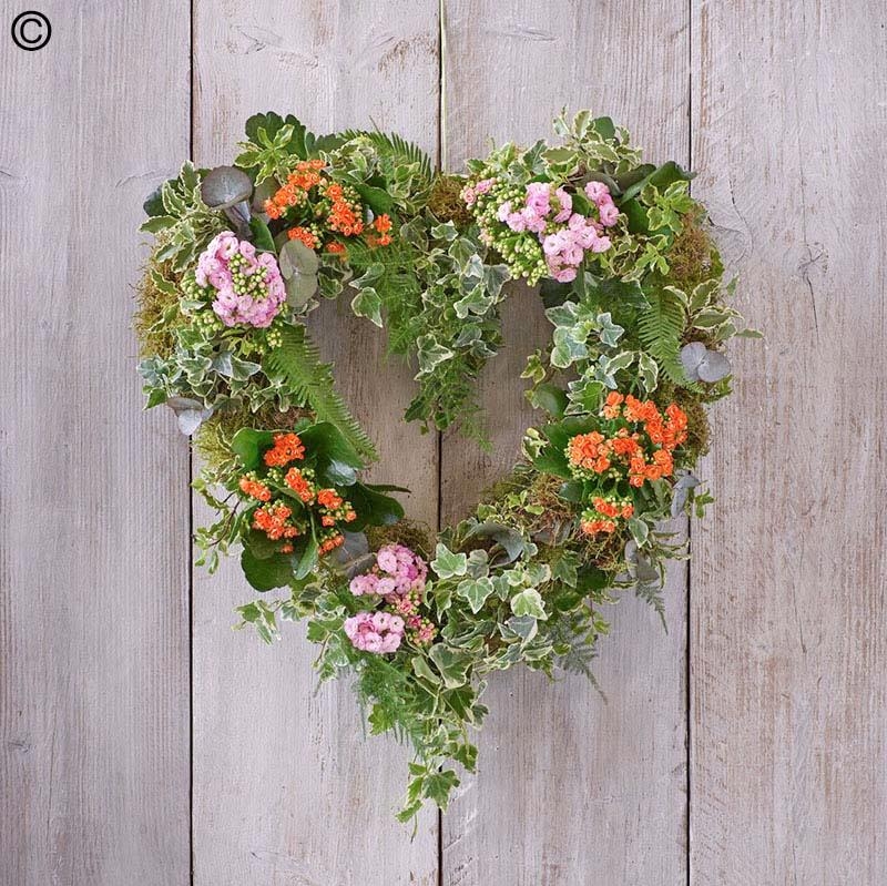 open heart funeral tribute with living plants and ivy