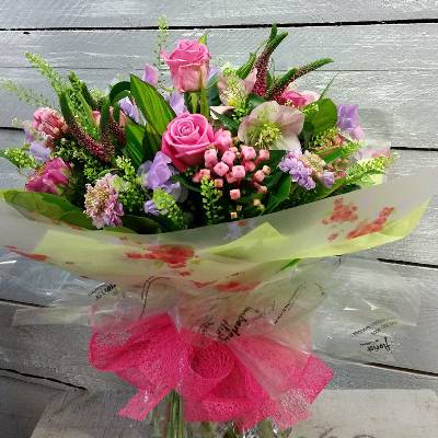 handtied flower bouquet gift wrapped in an a bubble of water or gift bag for monthly subcription service