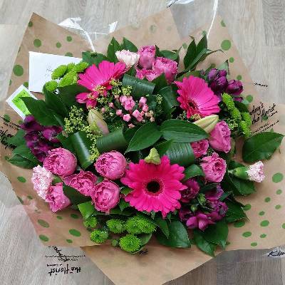 handtied flower bouquet gift wrapped in an a bubble of water or gift bag for monthly subcription service
