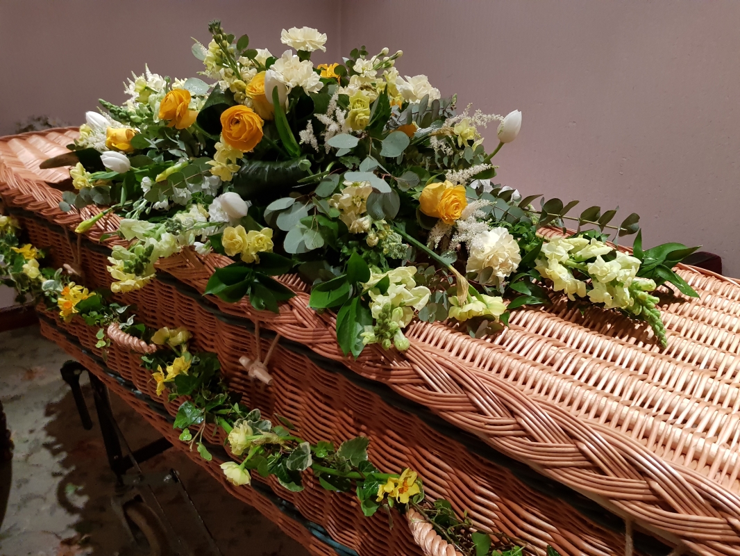 A pretty spring garland of rustic Ivy with selection of narcissus for a natural look.