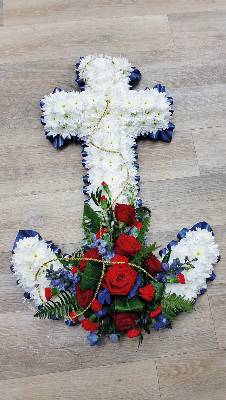 red, white and blue flower based anchor funeral tribute with ribbon edge 