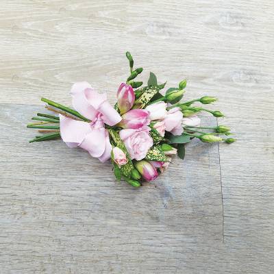 Small flower sheaf  funeral tribute with bow 