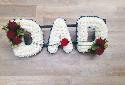 White based chrysanthemum dad letter funeral tribute with flower spray and blue ribbon edge