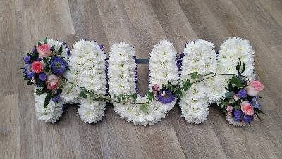 White based chrysanthemum mum letter funeral tribute with flower spray and purple ribbon edge
