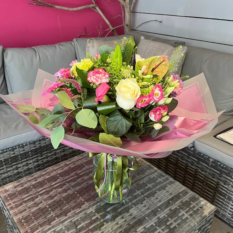 handtied flower bouquet gift wrapped in an a bubble of water or gift bag 