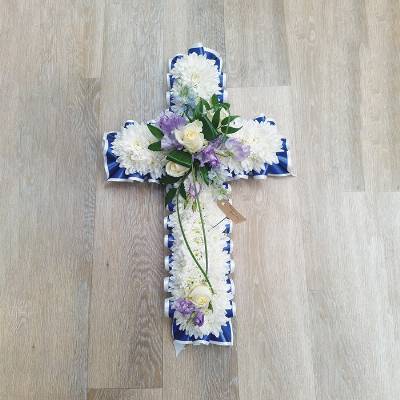 White chrysanthemum flower based cross funeral tribute with ribbon 