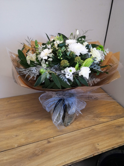 festive white chistmas flower handtied bouquet in a bubble of water