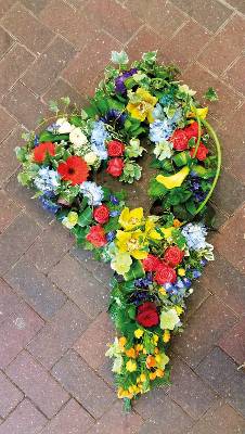 Mixed textured flower and foliage open heart funeral tribute 