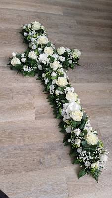 white flower and foliage cross funeral tribute 