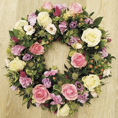 Mixed rose flower and foliage funeral tribute wreath 