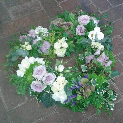 Lilac and white flower and foliage open heart funeral tribute 