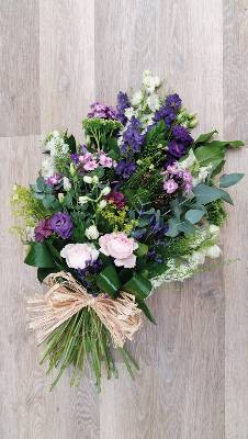 Country style pink and purple flower and foliage funeral tribute sheaf