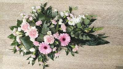 Pastels, baby pink and white flower and foliage single ended funeral coffin spray
