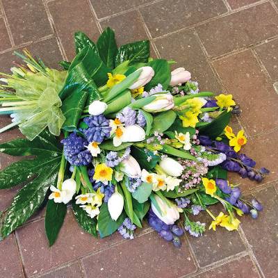 A hand-tied funeral sheaf with a scented spring mix of dainty little jonquil with classic tulips and beautiful hyacinths.