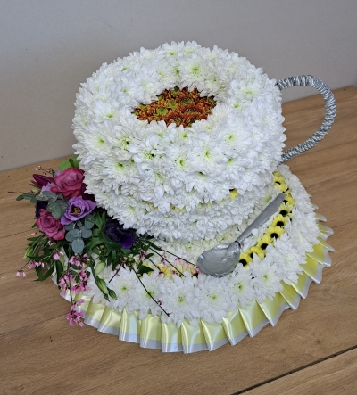 teacup and saucer flower aand foliage bespoke funeral tribute