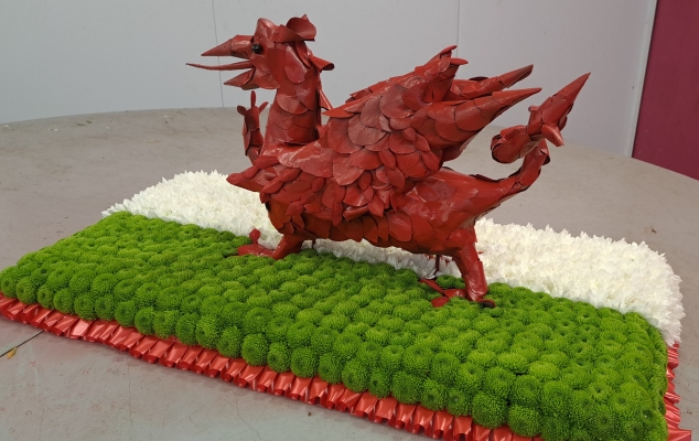 3d white, green and red welsh dragon flag flower funeral tribute