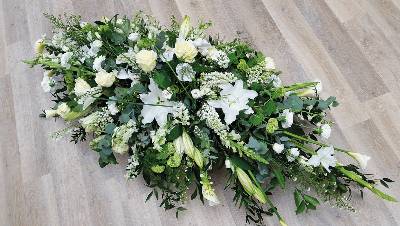 White, ivory and green flower and foliage double ended funeral coffin spray with lilies