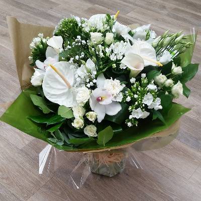 neutral white handtied flower bouquet gift wrapped in an aqua pack of water