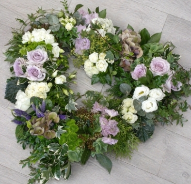 Lilac and white flower and foliage open heart funeral tribute 