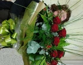 one dozen large red rose flower and mixed foliage handtied bouquet 
