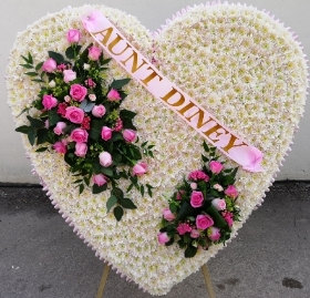 extra large white and pink flower heart shaped funeral tribute with rose spray