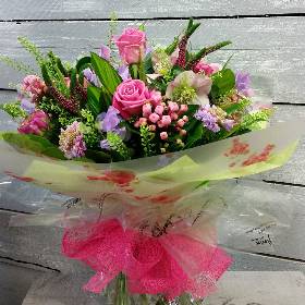 handtied flower bouquet gift wrapped in an a bubble of water or gift bag for monthly subcription service