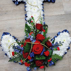 red, white and blue flower based anchor funeral tribute with ribbon edge 
