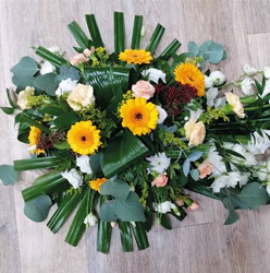 Autumnal flower and foliage single ended funeral coffin spray 