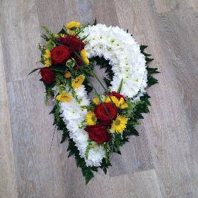 White chrysanthemum with flower and foliage spray chaplet funeral tribute