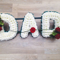 White based chrysanthemum dad letter funeral tribute with flower spray and blue ribbon edge