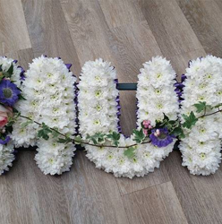 White based chrysanthemum mum letter funeral tribute with flower spray and purple ribbon edge